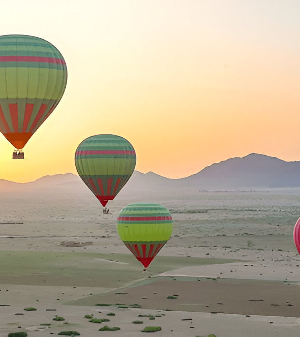 Hot air balloon floating over the countryside near Marrakech