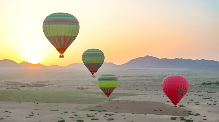 Hot air balloon floating over the countryside near Marrakech