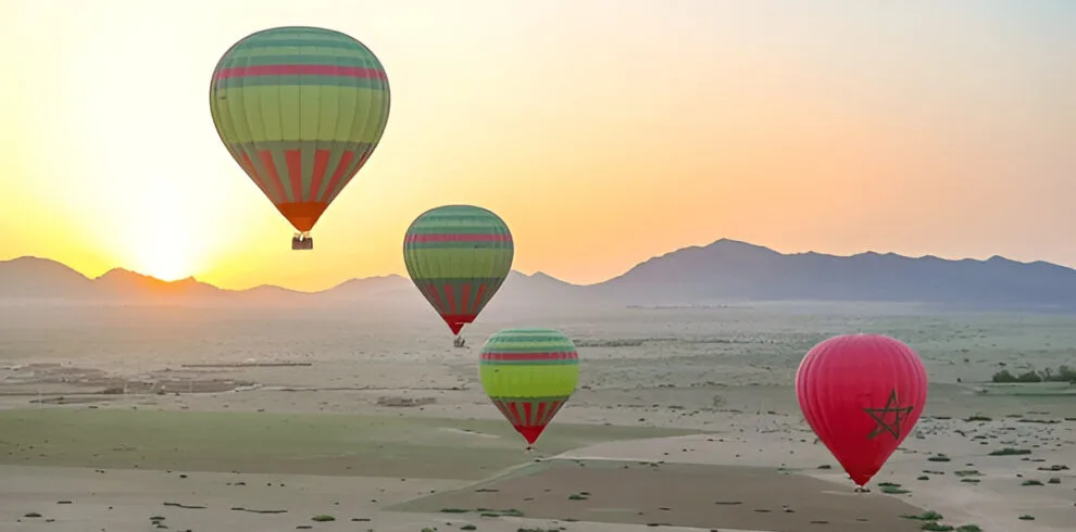 Hot air balloon floating over the countryside near Marrakech
