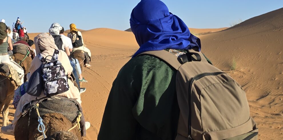 Camel trek crossing the dunes at Merzouga, Morocco