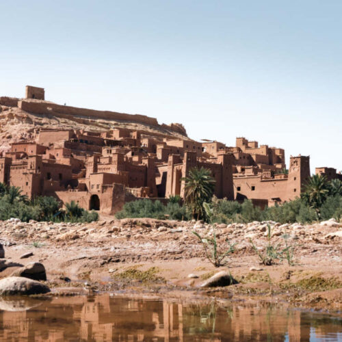 The kasbah of Ait Ben Haddou reflected in the river, southern Morocco