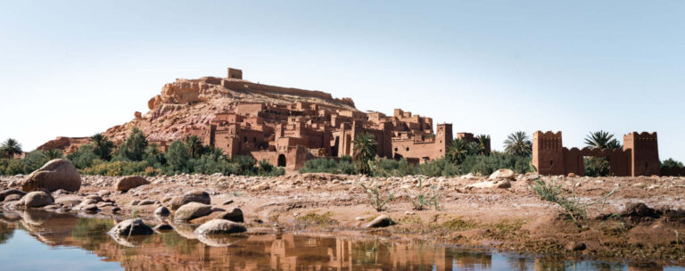 The kasbah of Ait Ben Haddou reflected in the river, southern Morocco