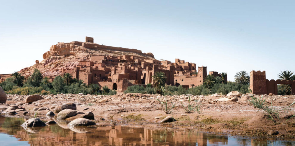 The kasbah of Ait Ben Haddou reflected in the river, southern Morocco