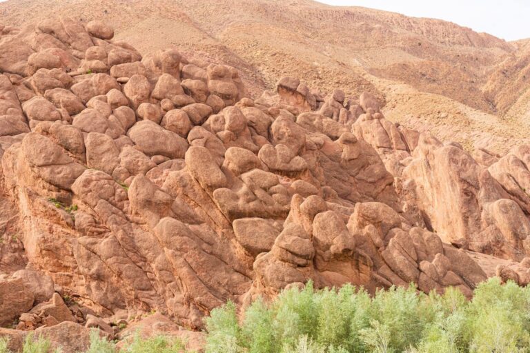 Weathered rock formations rising from the floor of the Dades Gorge in the eastern High Atlas