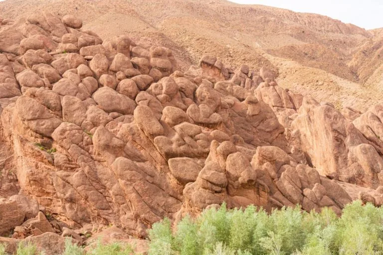 Weathered rock formations rising from the floor of the Dades Gorge in the eastern High Atlas