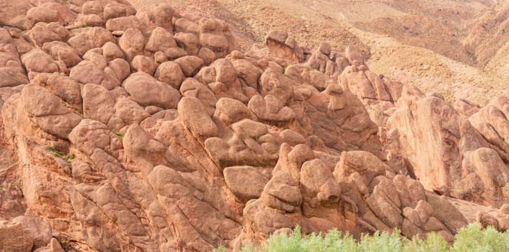 Weathered rock formations rising from the floor of the Dades Gorge in the eastern High Atlas