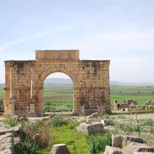 The Roman triumphal Arch of Caracalla standing among the ruins of Volubilis in northern Morocco