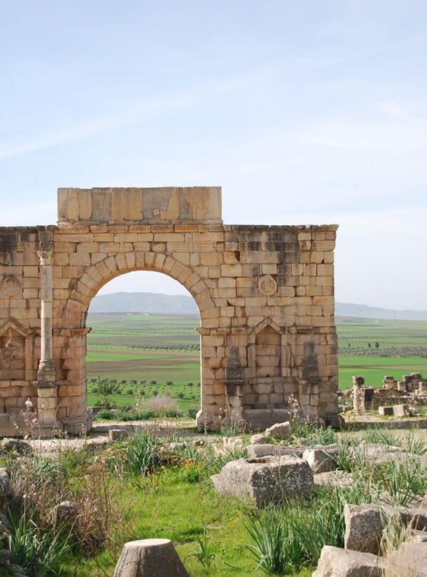 The Roman triumphal Arch of Caracalla standing among the ruins of Volubilis in northern Morocco